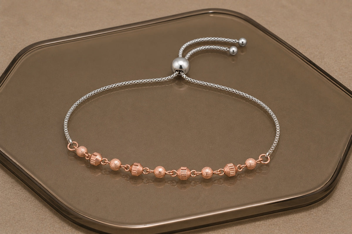 One Solace bracelet combining a silver chain with rose gold beads
