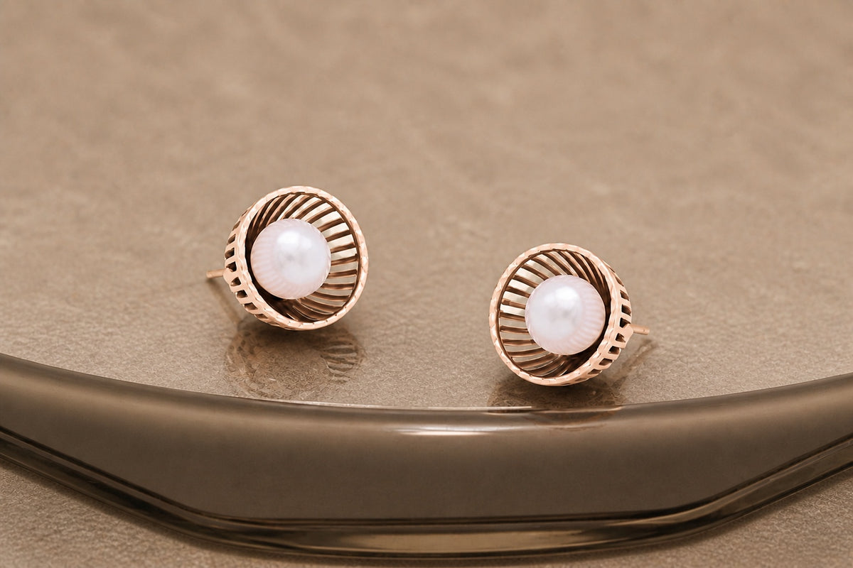 Lunara pearl studs with a rose gold finish