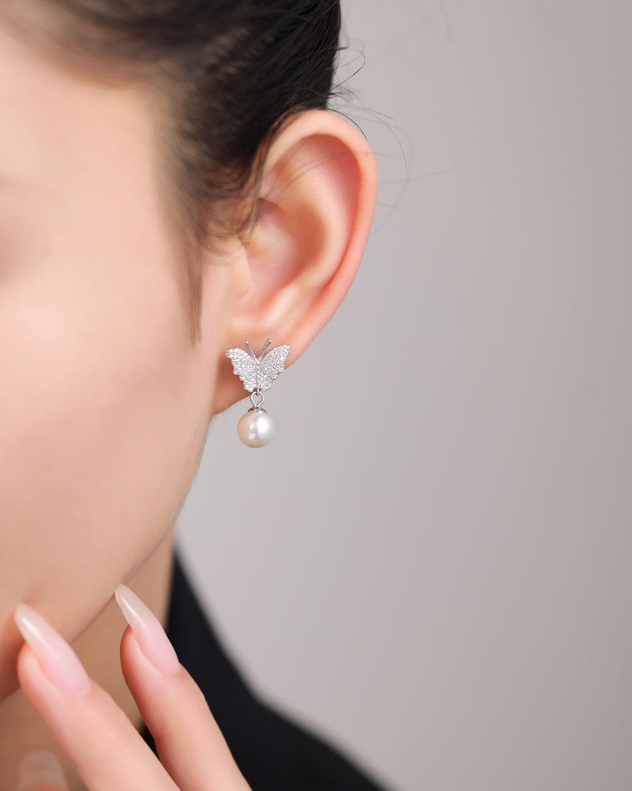 Pearl wings, softly styled.